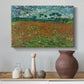 Canvas art print featuring a landscape emphasizing contrast between red blossoms and green field, styled above a decorative console