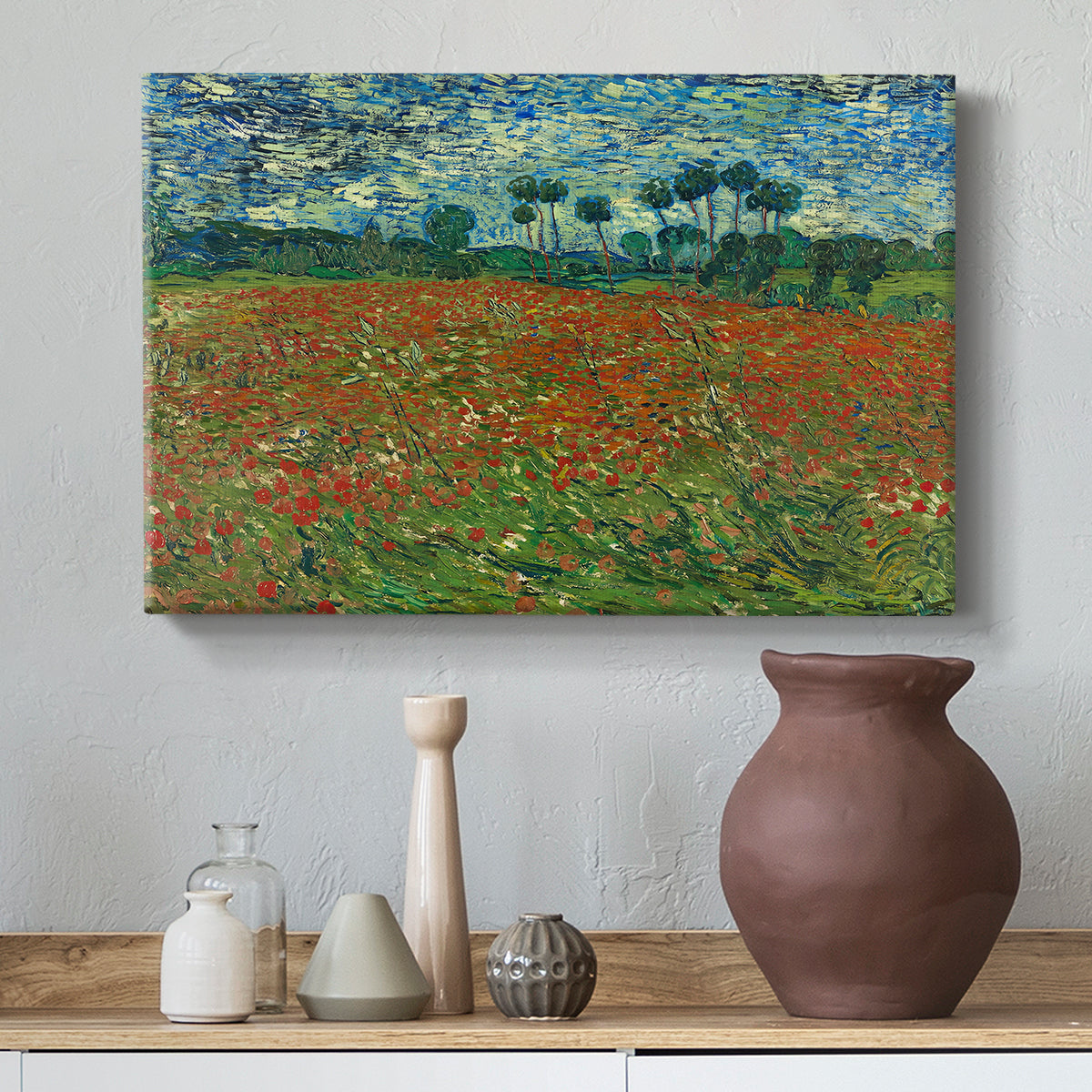 Canvas art print featuring a landscape emphasizing contrast between red blossoms and green field, styled above a decorative console