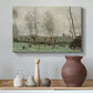Canvas art print featuring a soft landscape with people and trees in calm setting, styled above a decorative console