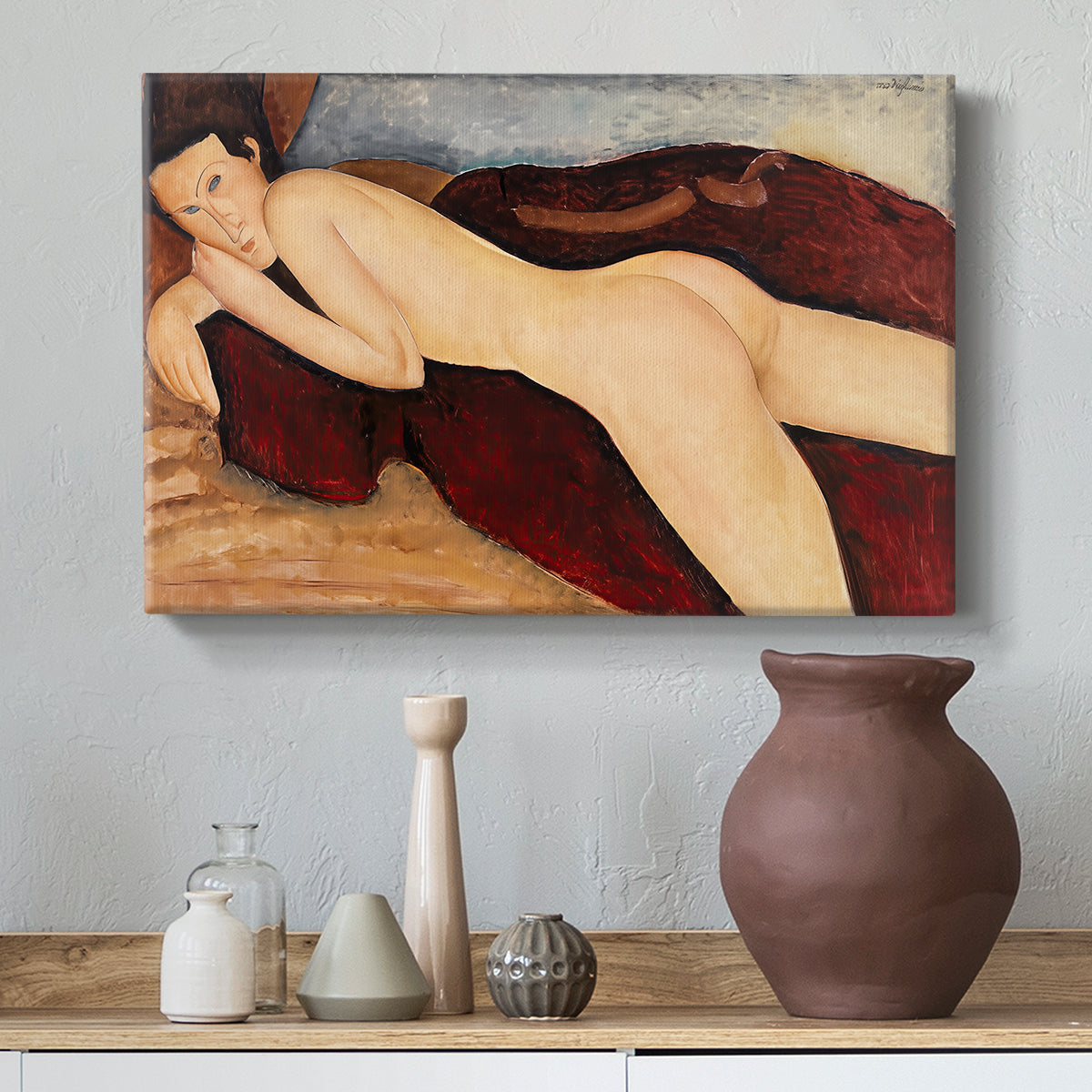 Canvas art print featuring a modernist nude figure lying face down with simplified contours, styled above a decorative console