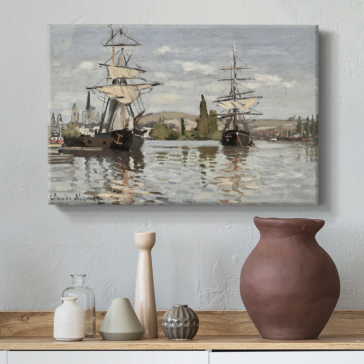 Canvas art print featuring a harbor view with tall ships lining the waterfront in muted tones, styled above a decorative console