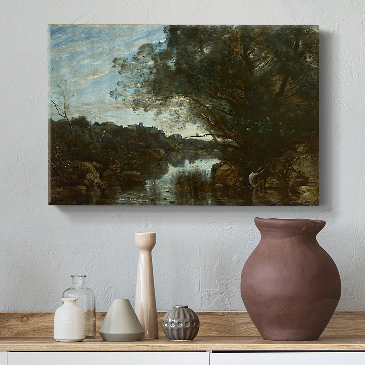 Canvas art print featuring an atmospheric landscape with lake and layered terrain, styled above a decorative console