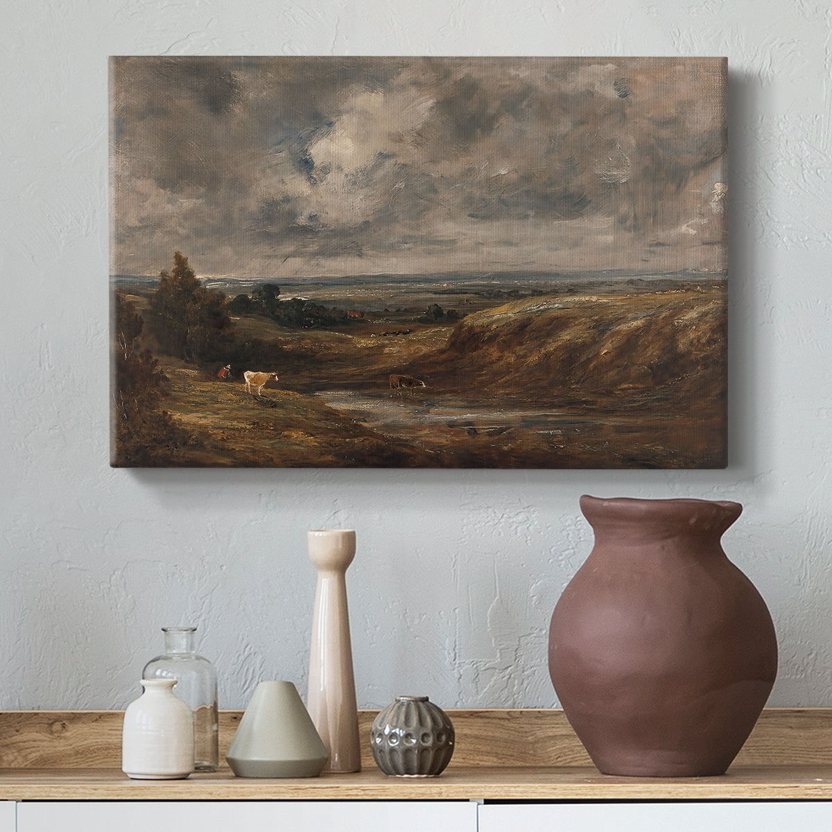 Canvas art print featuring an atmospheric countryside view, styled above a decorative console