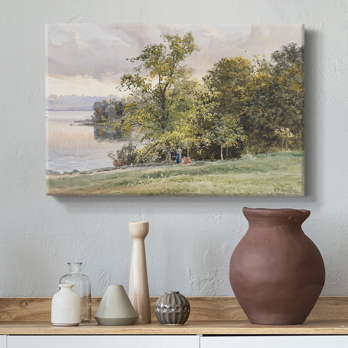 Canvas art print featuring a natural setting with water, trees, and open sky, styled above a decorative console