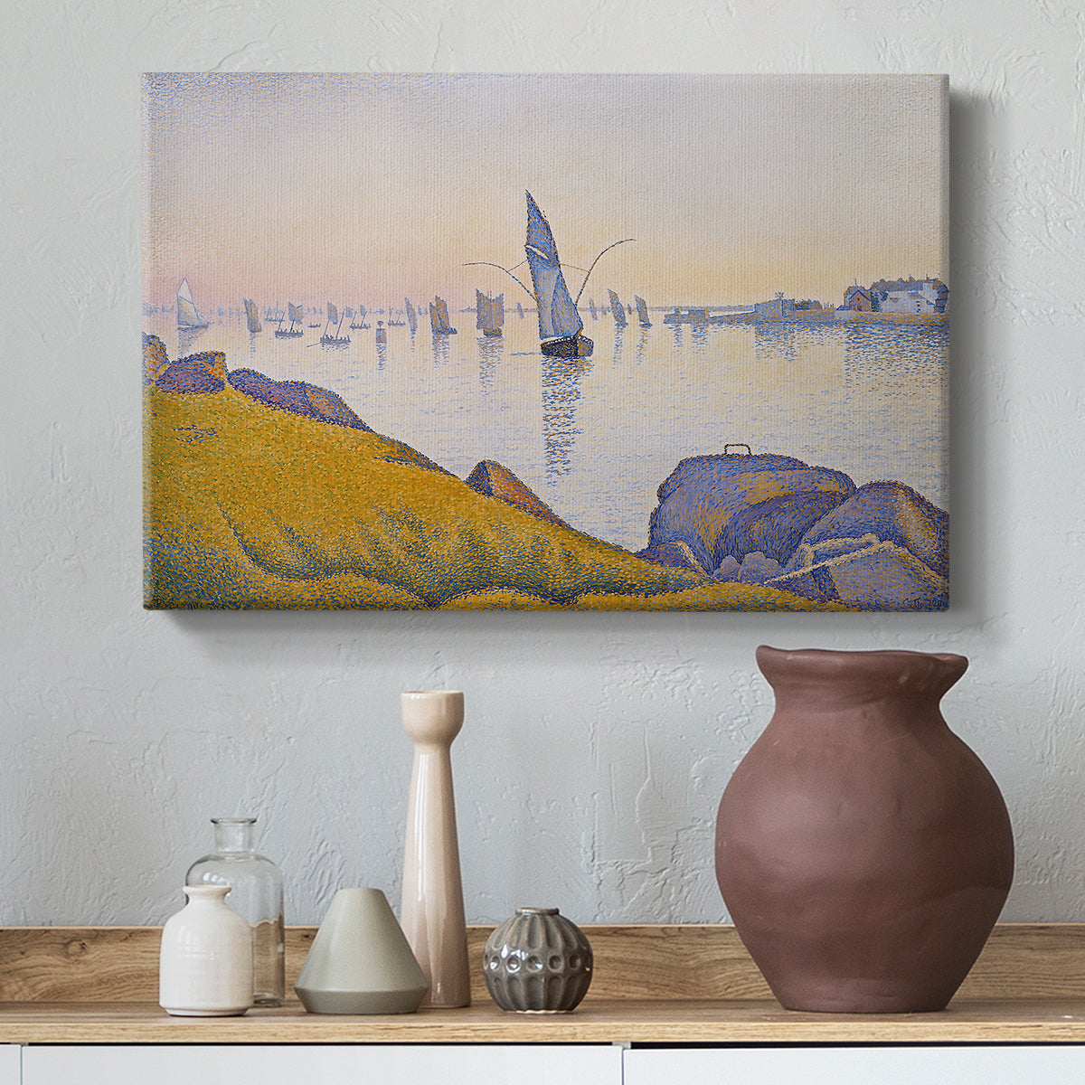 Canvas art print featuring a pointillist sunset harbor with calm sea, styled above a decorative console