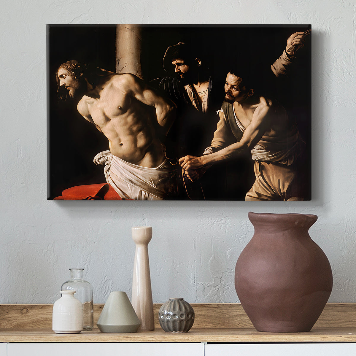 Canvas art print featuring a biblical depiction of men whipping Christ tied to pillar, styled above a decorative console