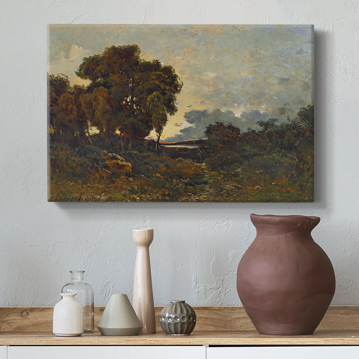 Canvas art print featuring a tranquil sunset view with trees and water, styled above a decorative console