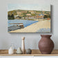 Canvas art print featuring a landscape with shoreline and architecture, styled above a decorative console
