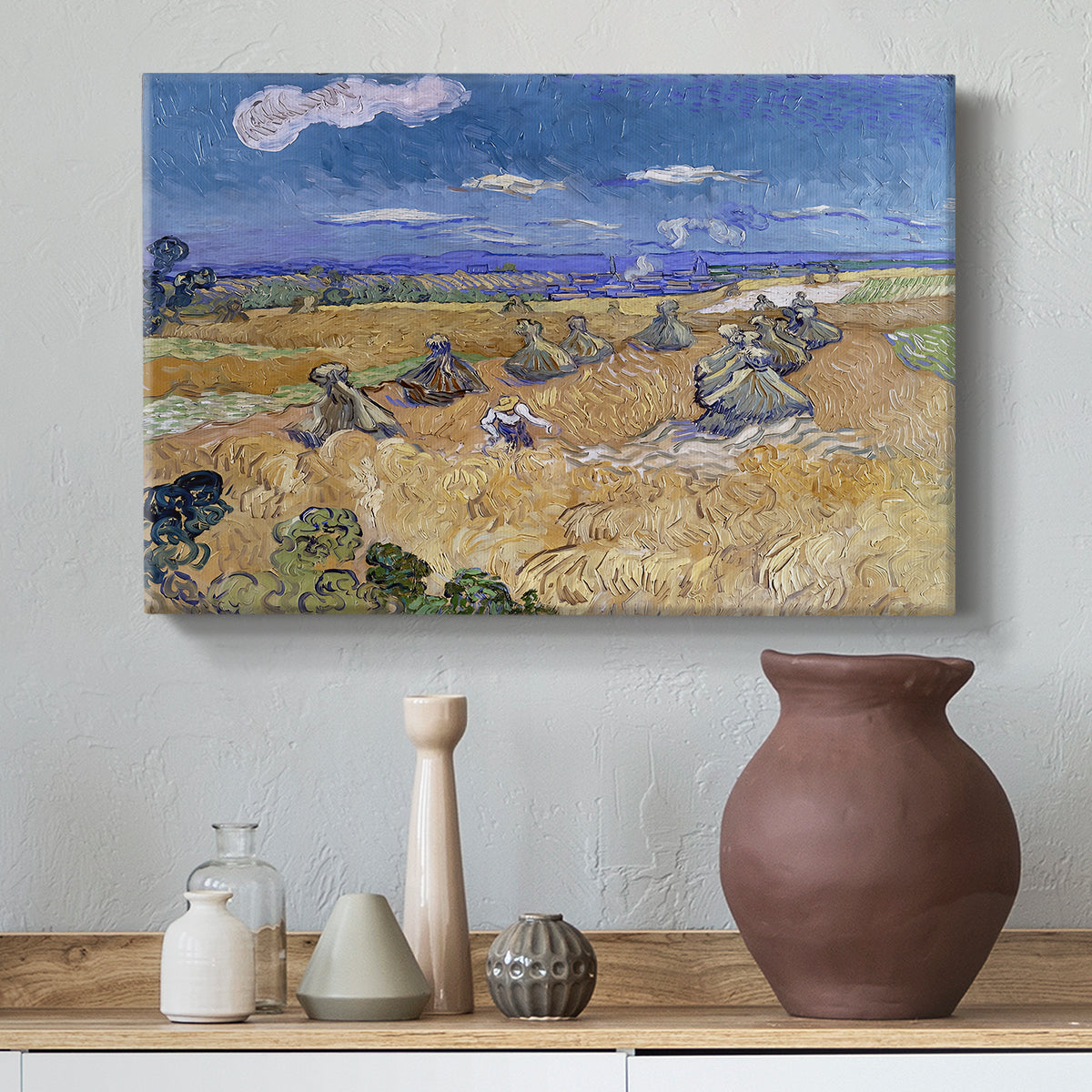 Canvas art print featuring an expressive landscape combining figure and agriculture, styled above a decorative console