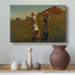 Canvas art print featuring a countryside composition with figures positioned near simple structure, styled above a decorative console