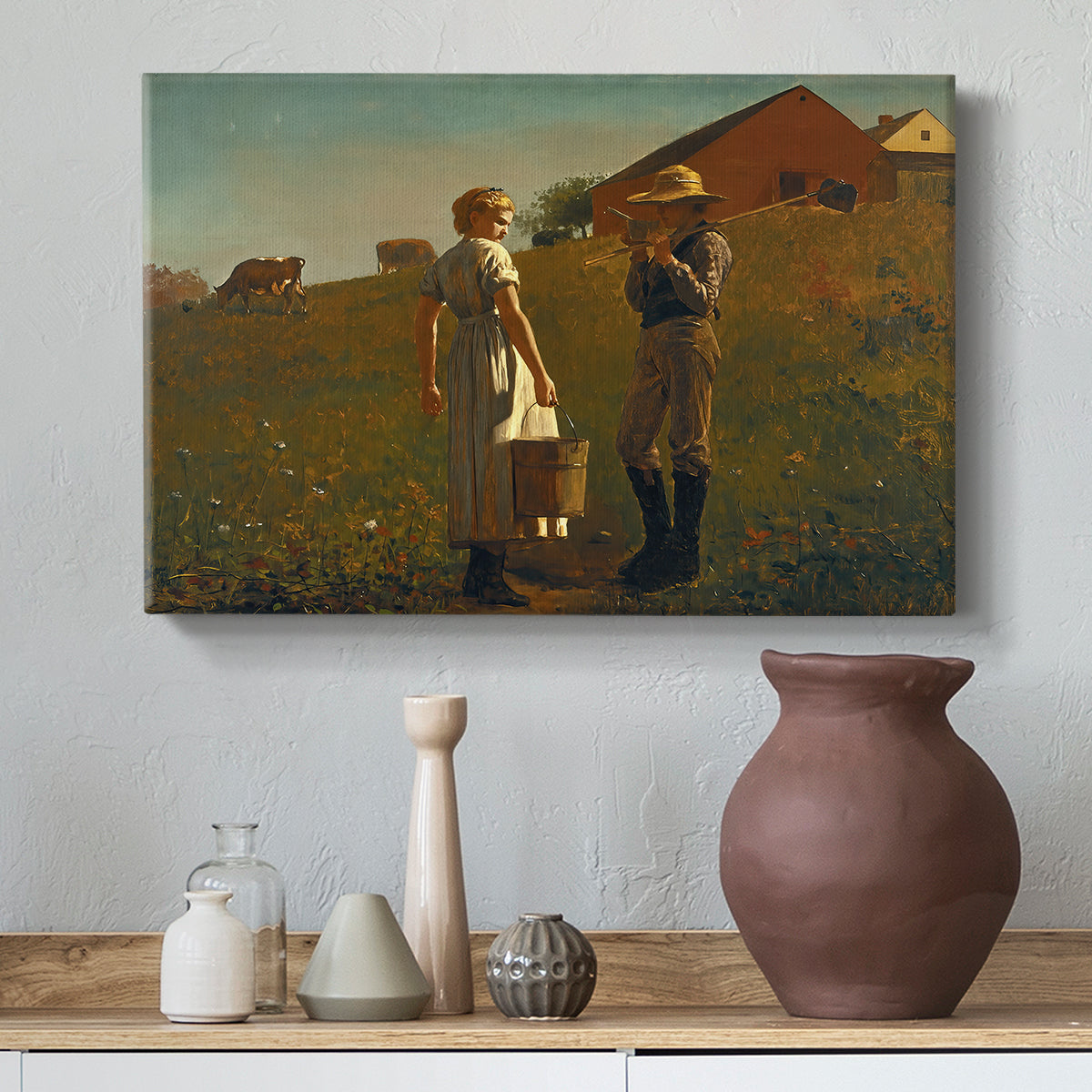 Canvas art print featuring a countryside composition with figures positioned near simple structure, styled above a decorative console