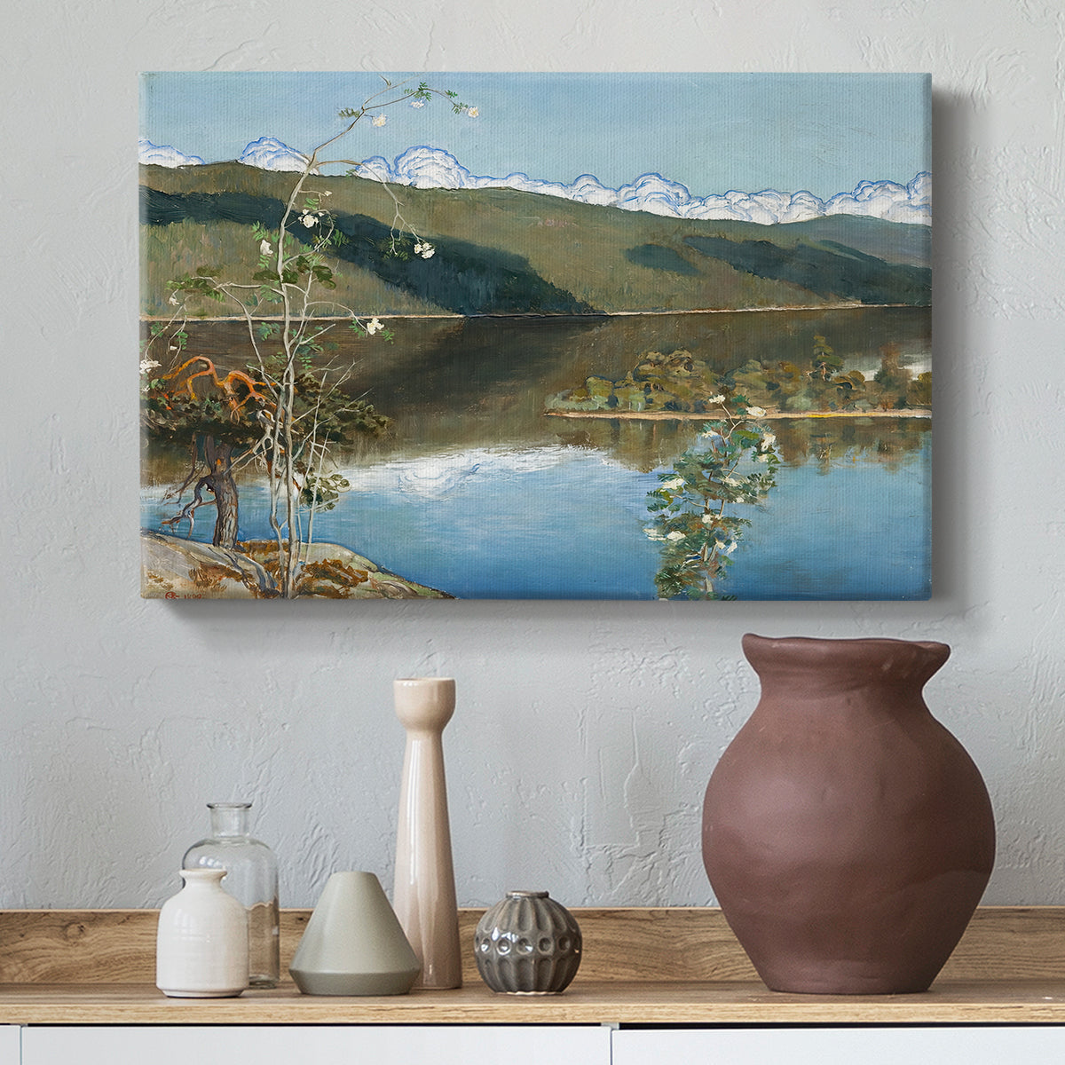 Canvas art print featuring an expansive view of land and water beneath approaching storm clouds, styled above a decorative console