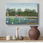 Canvas art print featuring a stylized composition of flamingos in natural setting, styled above a decorative console
