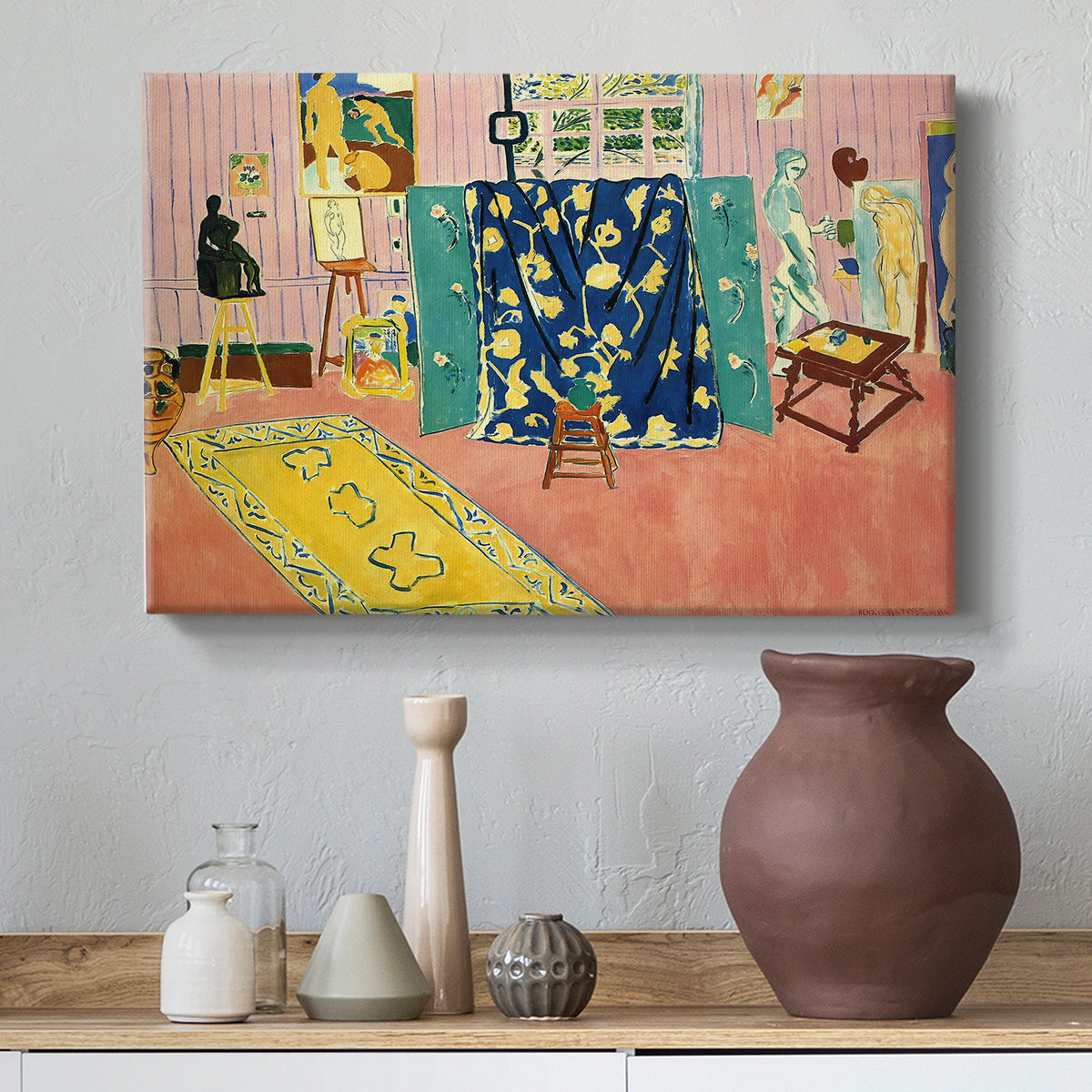 Canvas art print featuring an expressive interior of a bright pink workspace, styled above a decorative console