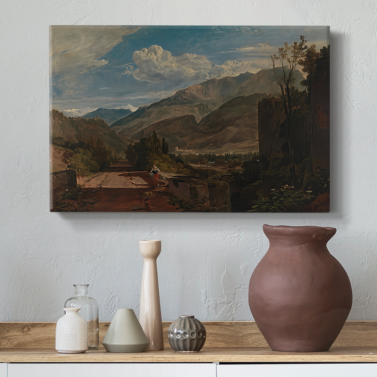 Canvas art print featuring an expressive landscape with elevation, styled above a decorative console