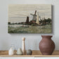 Canvas art print featuring a rustic scene with windmill and reflections in water, styled above a decorative console