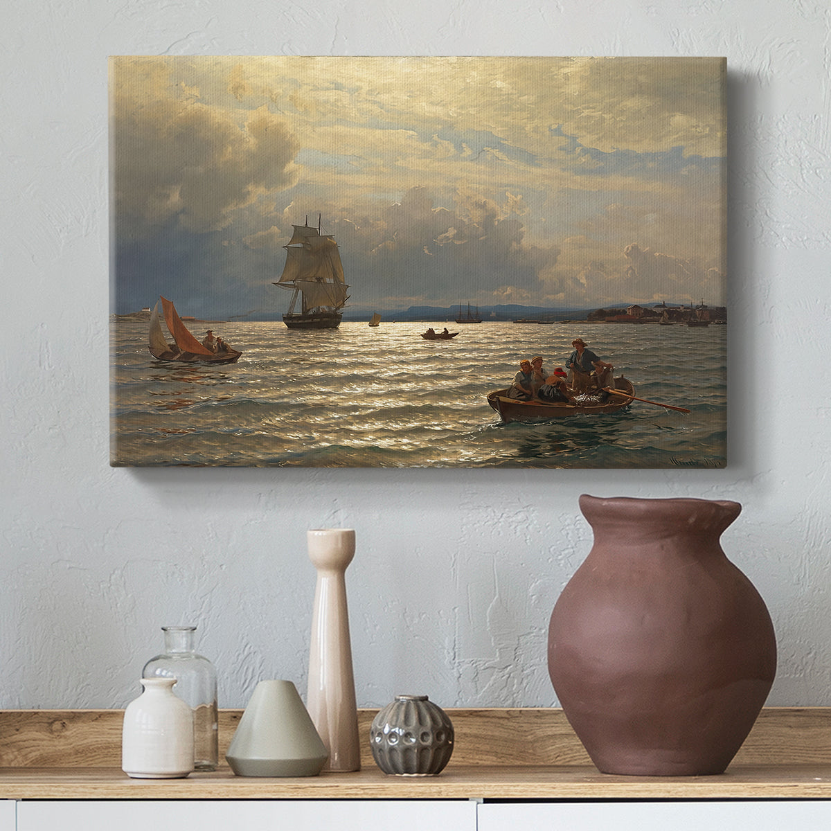Canvas art print featuring a coastal landscape with boats resting on quiet water, styled above a decorative console