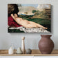 Canvas art print featuring a serene figure resting in natural setting with flowing form, styled above a decorative console