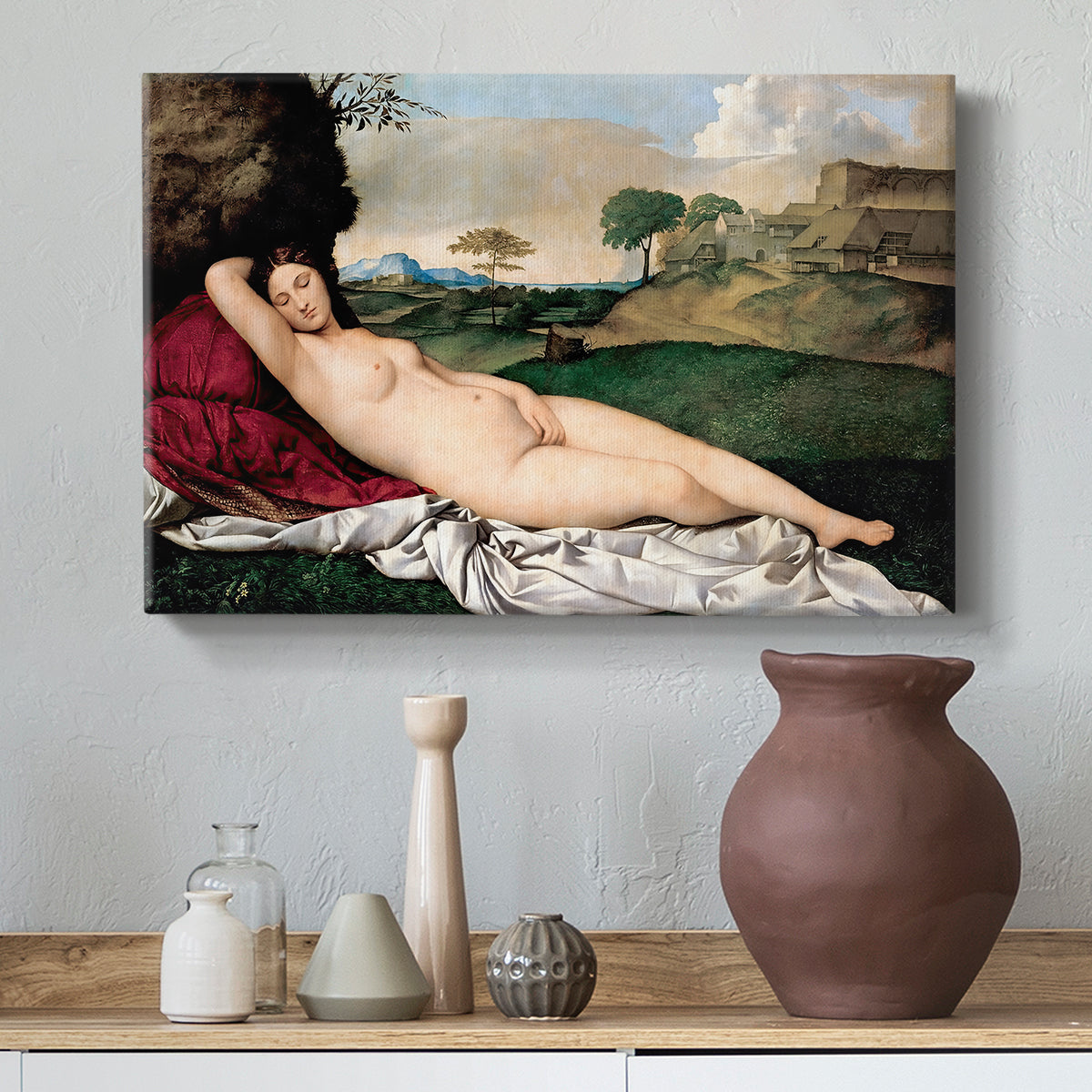 Canvas art print featuring a serene figure resting in natural setting with flowing form, styled above a decorative console