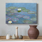 Canvas art print featuring a tranquil water surface covered with blooming lilies, styled above a decorative console