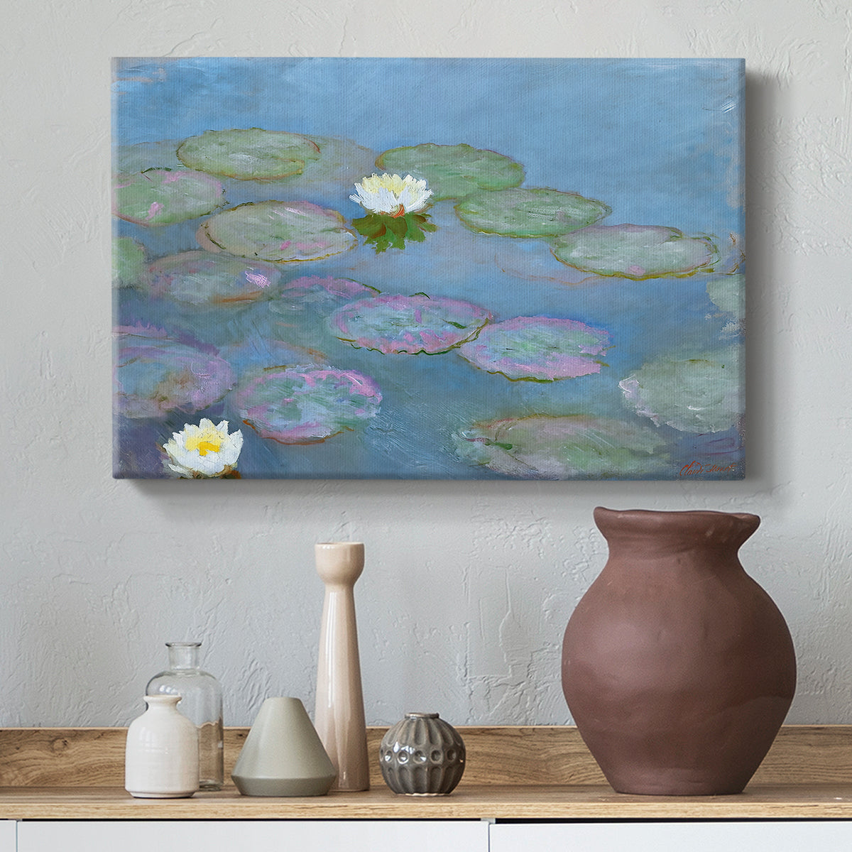 Canvas art print featuring a tranquil water surface covered with blooming lilies, styled above a decorative console