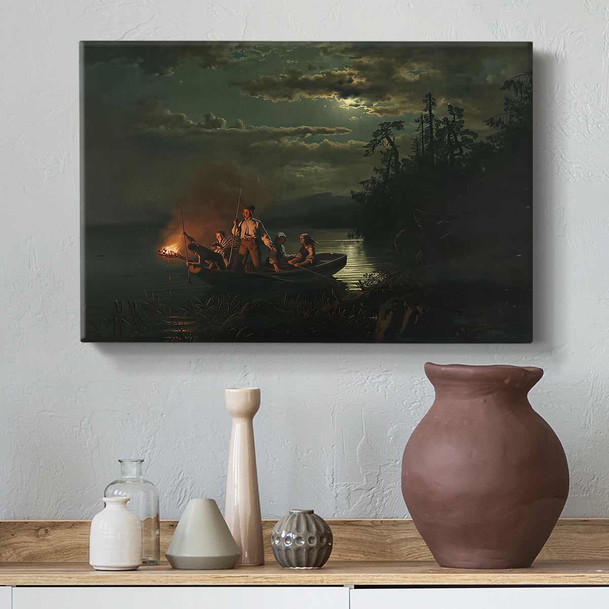Canvas art print featuring a tranquil lake setting with figures engaged in traditional fishing, styled above a decorative console