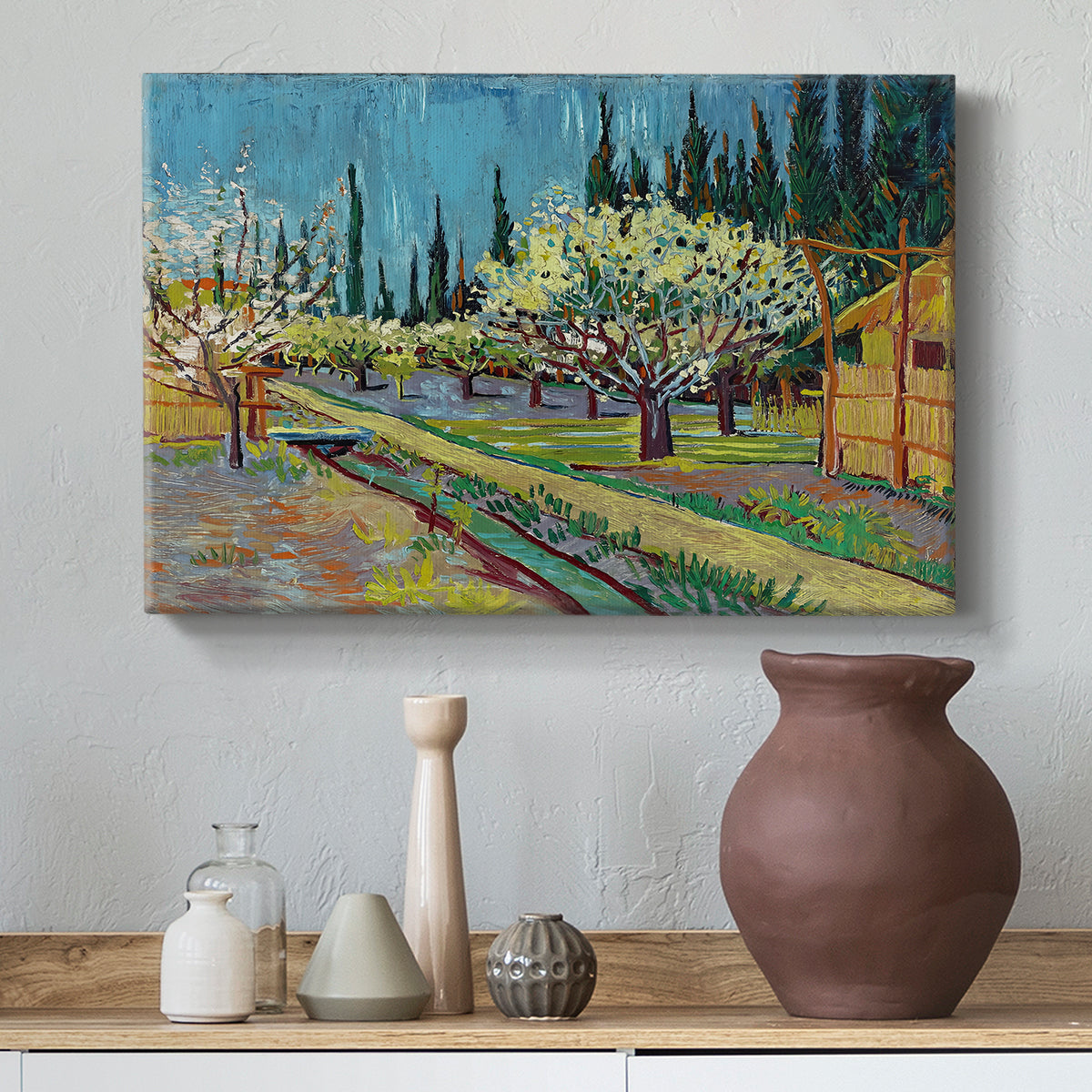 Canvas art print featuring an agricultural scene with orchard framed by vertical trees, styled above a decorative console