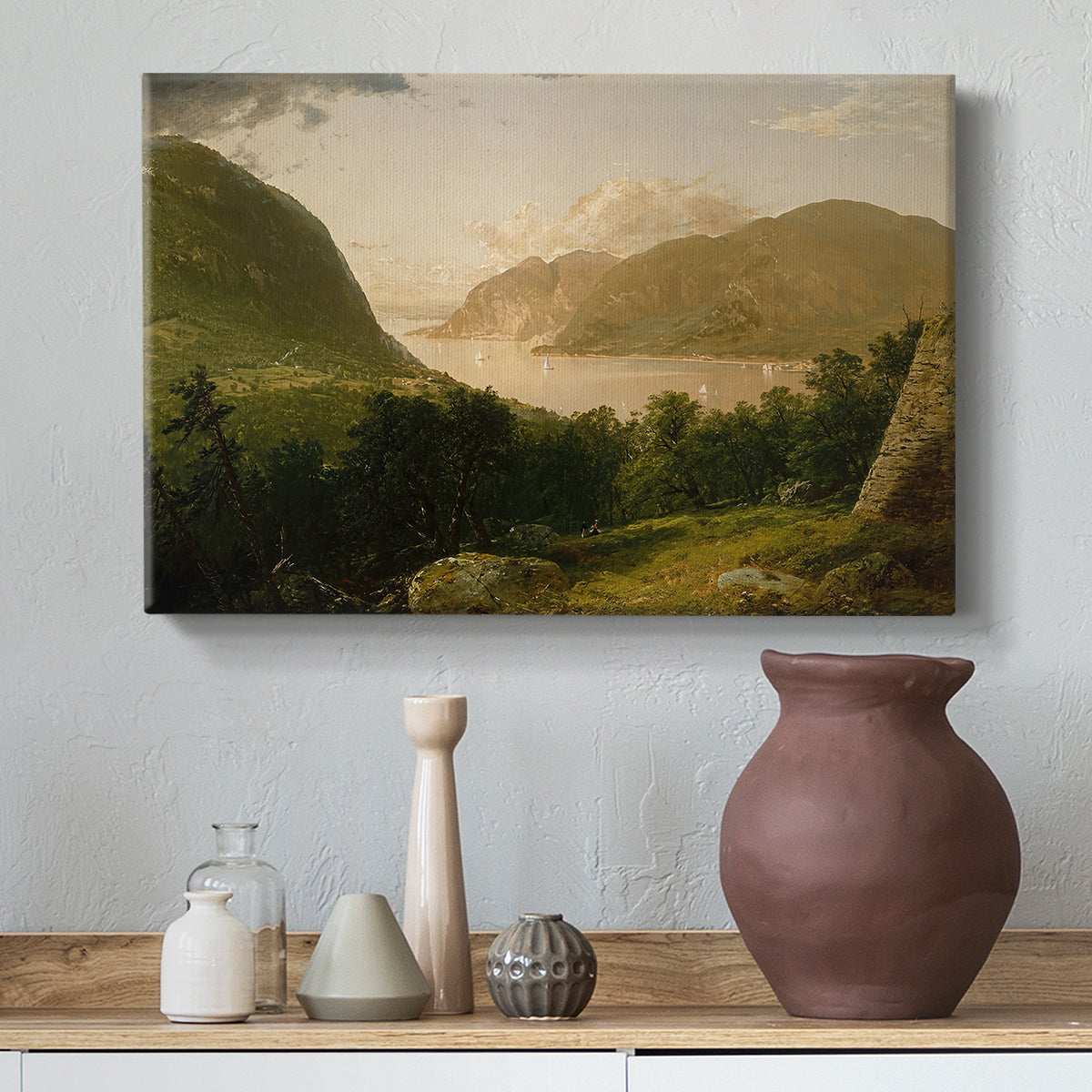 Canvas art print featuring a tranquil natural setting with river and horizon, styled above a decorative console