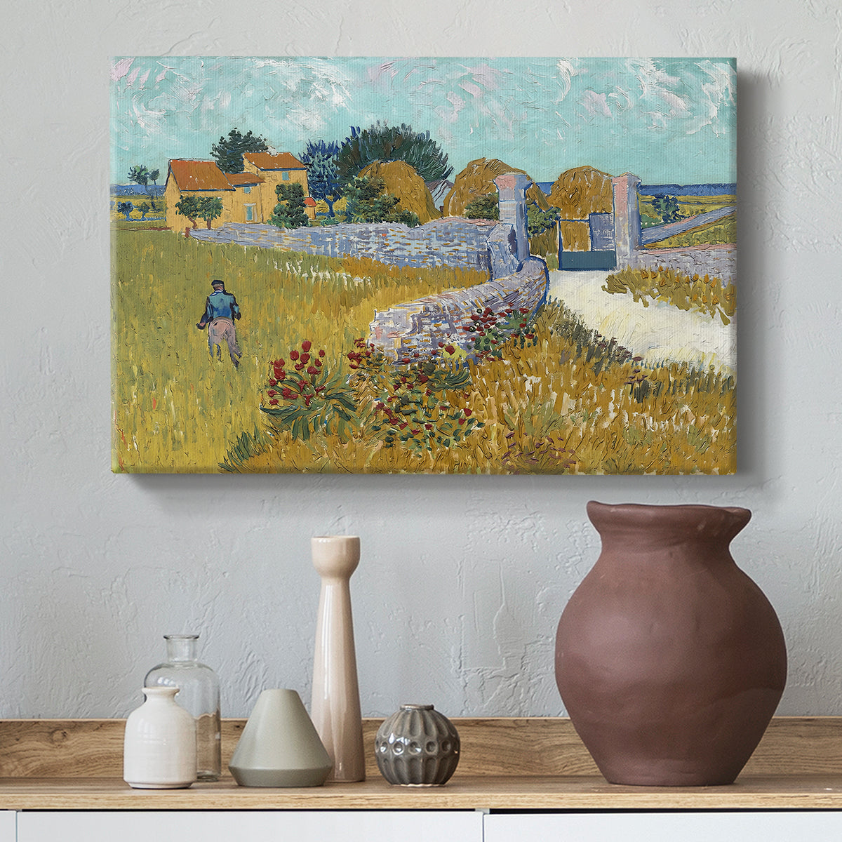 Canvas art print featuring a countryside composition with house and open terrain, styled above a decorative console