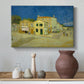 Canvas art print featuring an architectural composition featuring corner house and street, styled above a decorative console