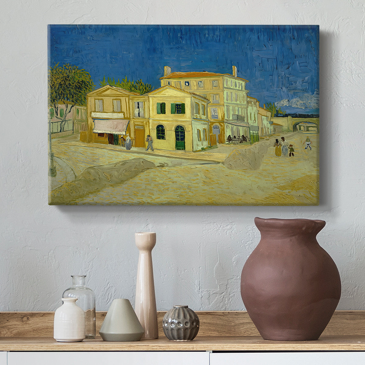 Canvas art print featuring an architectural composition featuring corner house and street, styled above a decorative console