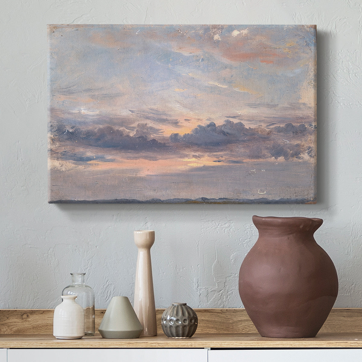 Canvas art print featuring an expressive sky scene with soft color transitions, styled above a decorative console