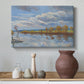 Canvas art print featuring a pointillist landscape featuring water, styled above a decorative console