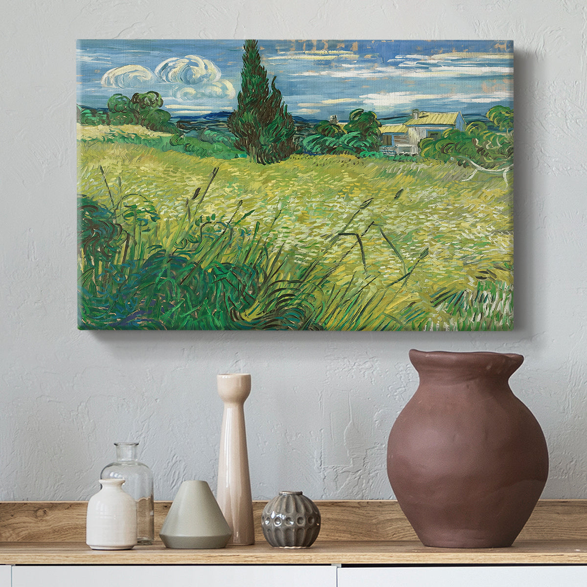 Canvas art print featuring a post-impressionist scene combining crops and dramatic sky, styled above a decorative console