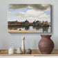 Canvas art print featuring an atmospheric city view with reflections, styled above a decorative console
