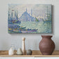 Canvas art print featuring a pointillist skyline on the water, styled above a decorative console