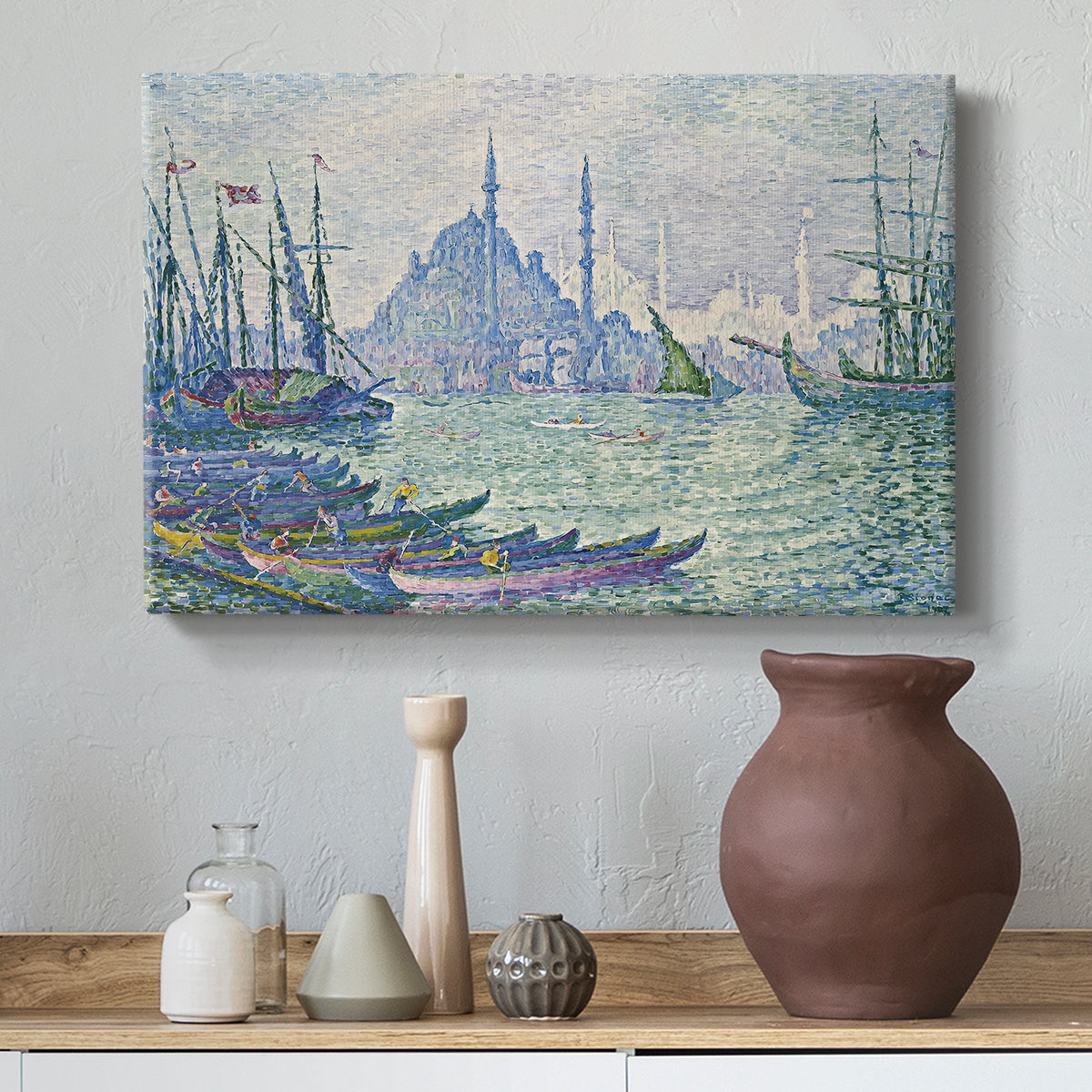 Canvas art print featuring a pointillist skyline on the water, styled above a decorative console