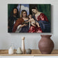 Canvas art print featuring a Renaissance devotional composition with richly dressed saints, styled above a decorative console