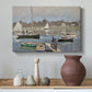 Canvas art print featuring a harbor basin filled with boats under soft sky, styled above a decorative console