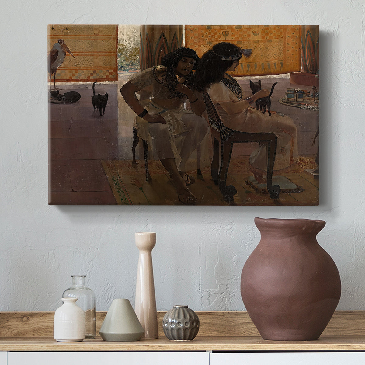 Canvas art print featuring a decorative composition with people in classical Egyptian attire, styled above a decorative console