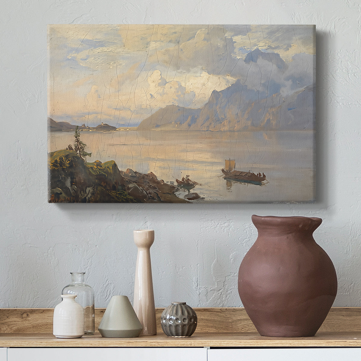 Canvas art print featuring an alpine lake landscape with reflections and open sky, styled above a decorative console