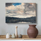 Canvas art print featuring a calm lake composition with trees reflected in water, styled above a decorative console
