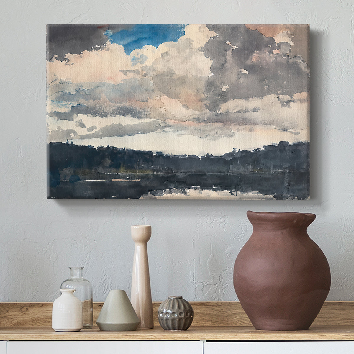 Canvas art print featuring a calm lake composition with trees reflected in water, styled above a decorative console