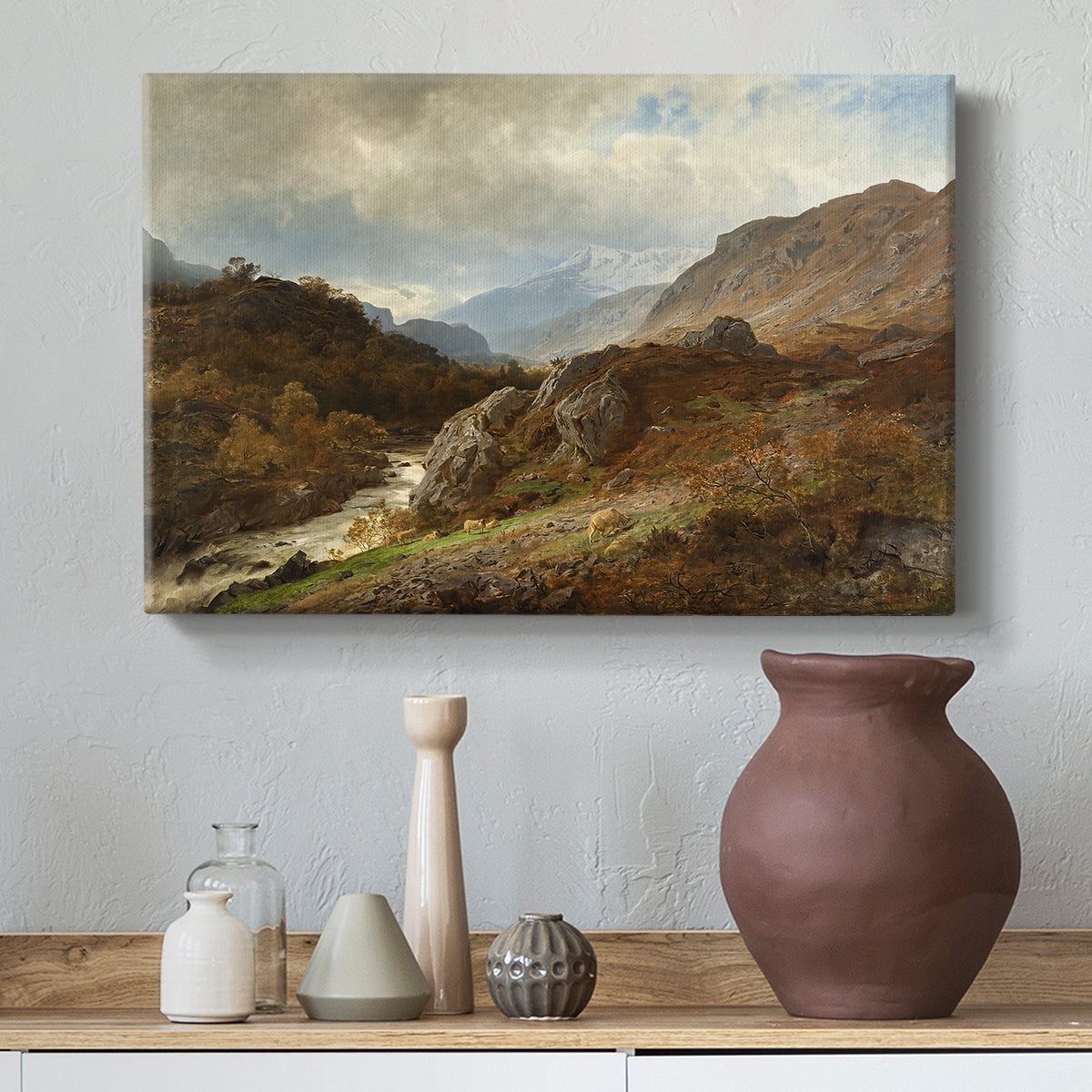 Canvas art print featuring a natural scene with elevation and layered mountains, styled above a decorative console