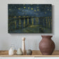 Canvas art print featuring a riverside view with figures near water under star-filled sky, styled above a decorative console