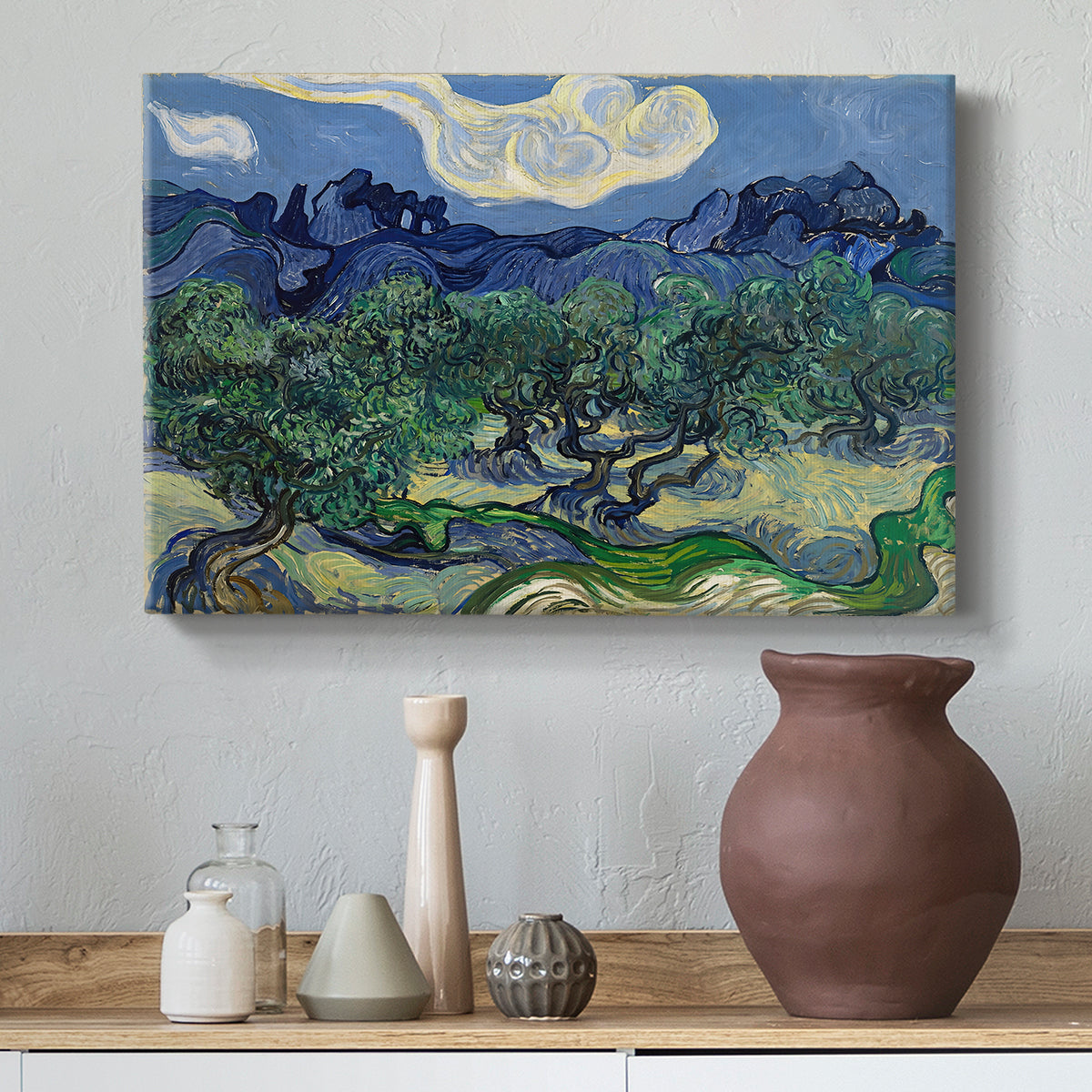 Canvas art print featuring a landscape combining foreground grove and distant peaks, styled above a decorative console
