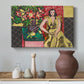 Canvas art print featuring a colorful interior with a seated woman and blooming flowers, styled above a decorative console