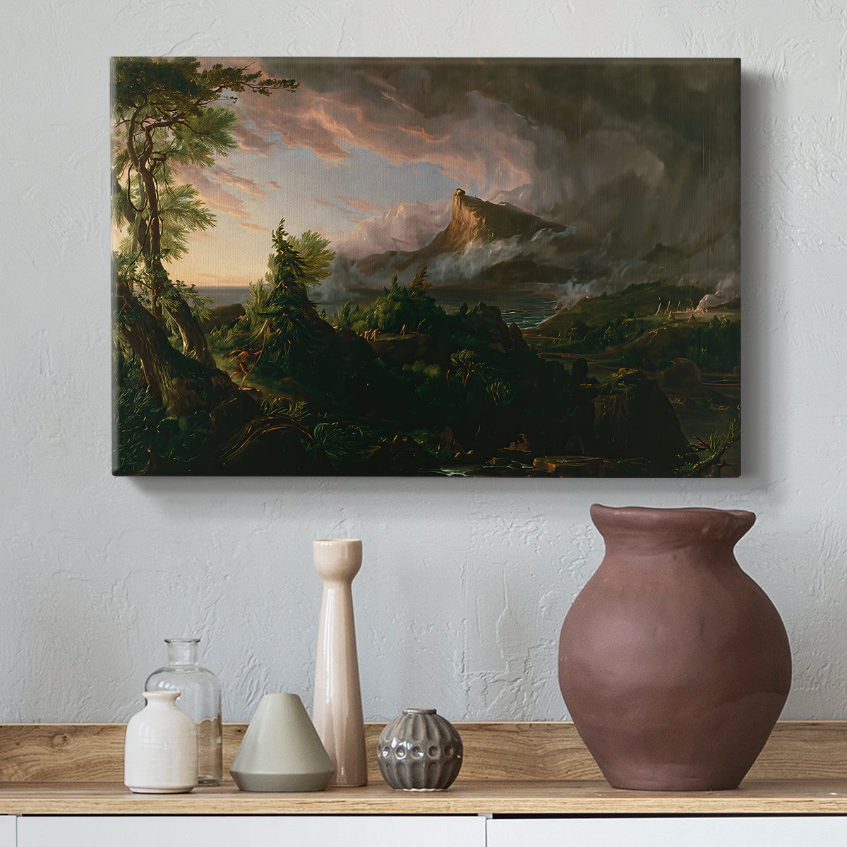 Canvas art print featuring a rugged landscape with minimal human presence and raw terrain, styled above a decorative console