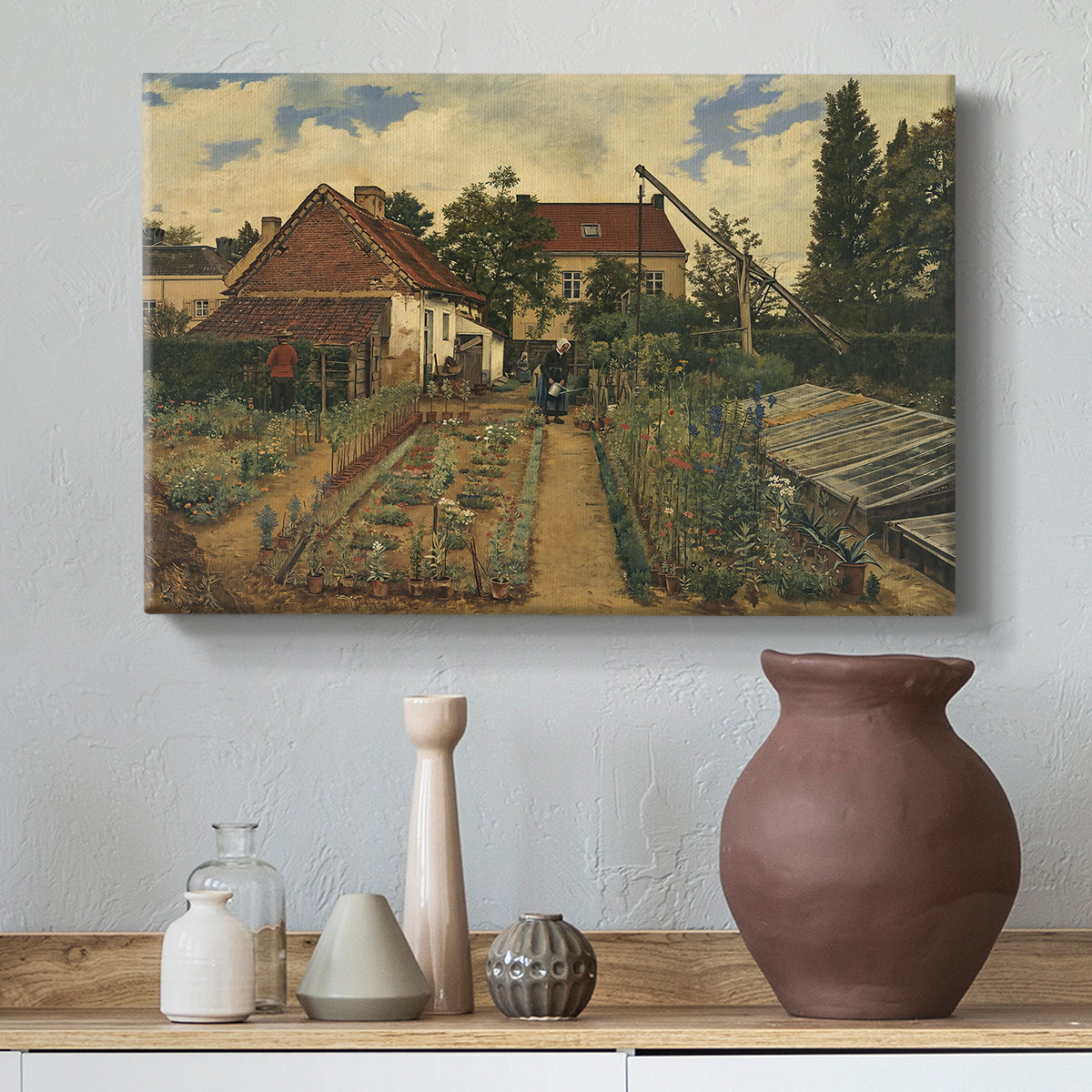 Canvas art print featuring an outdoor space with greenery surrounding small structure, styled above a decorative console
