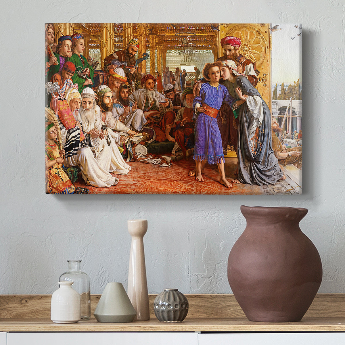 Canvas art print featuring a religious gathering with layered figures and interior depth, styled above a decorative console